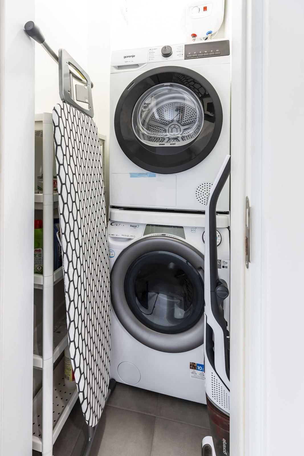 Laundry cupboard with washer, dryer and ironing board