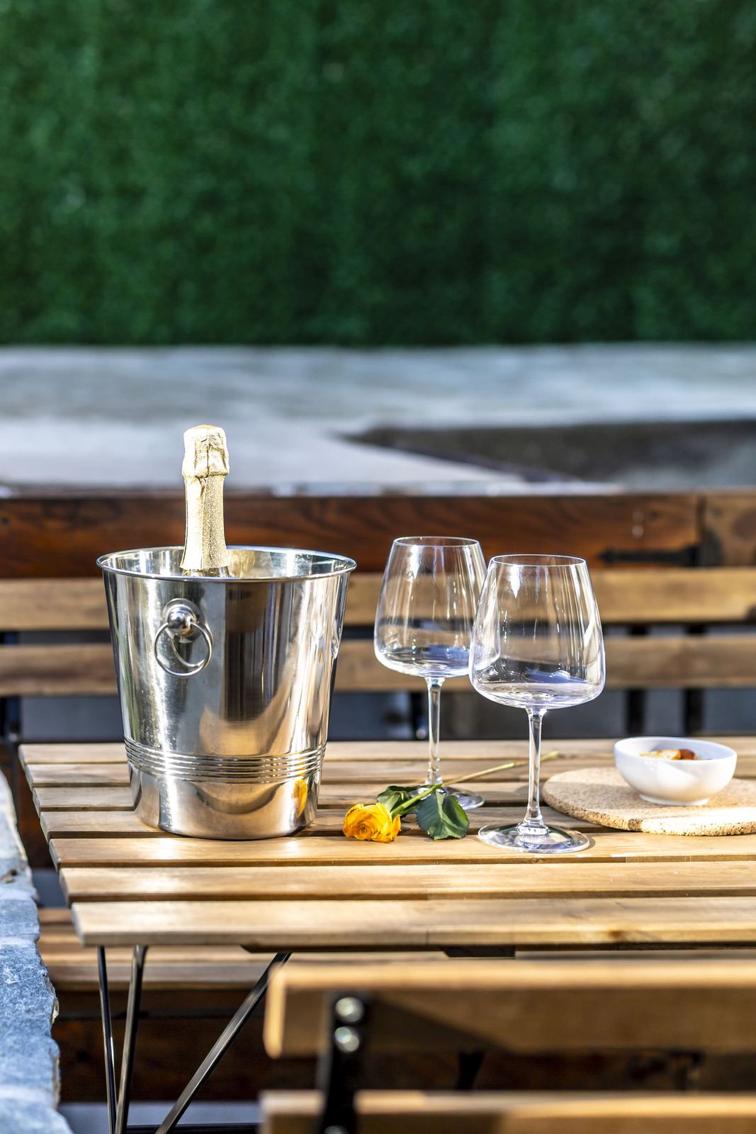 Outdoor table with champagne bucket and glasses