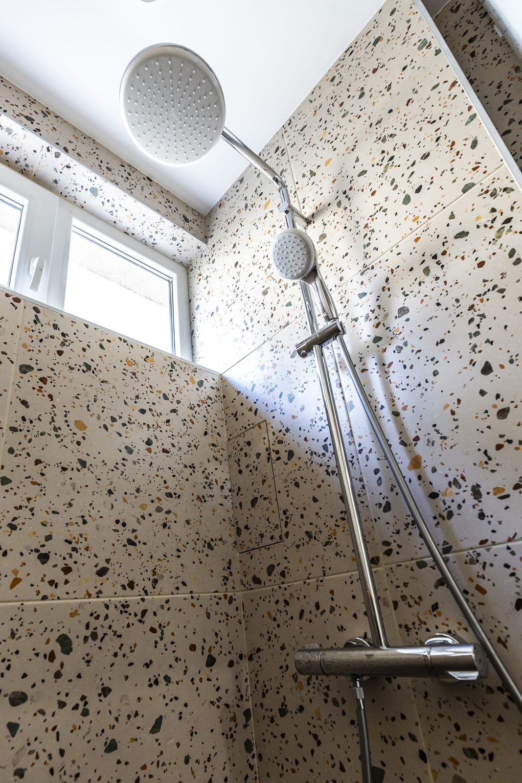 Shower with rain head and terrazzo tiles